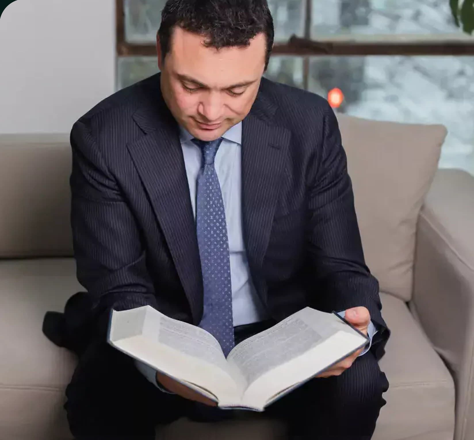 Sam Pastor reading a law book